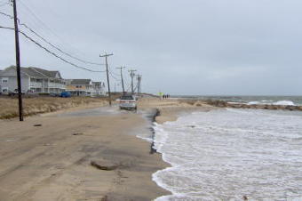 Erosion on Menauhant Rd. which  was constructed on the barrier beach south of Great Pond.