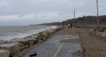 Shining Sea bikepath near Surf Drive was overtopped with waves during the night leaving much gravel and sand.