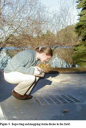 BBNEP Staffer Aria Brissette inspects a catch basin.